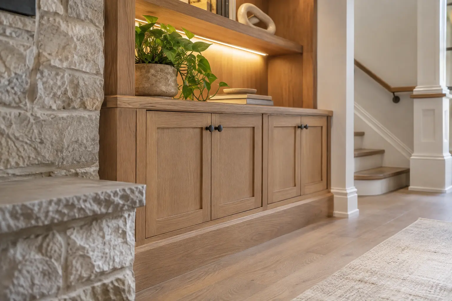 Detailed basement cabinetry, stone and painted trim in warm daylight.